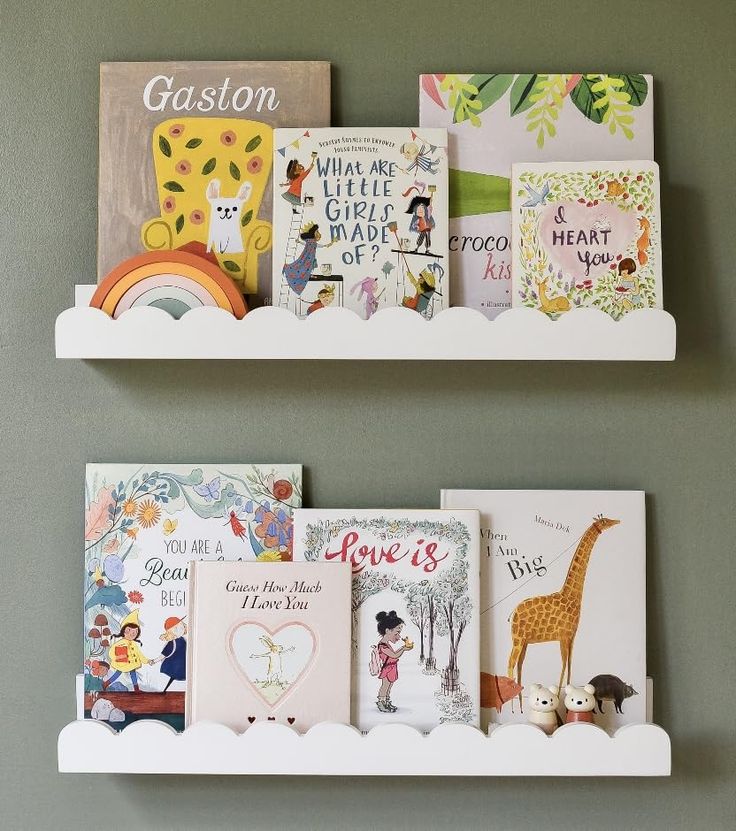 two white bookshelves filled with children's books on top of each other