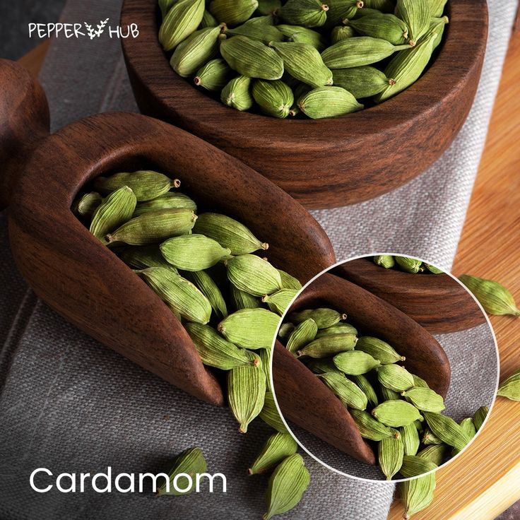 there are two wooden bowls filled with cardamoa beans on top of a table