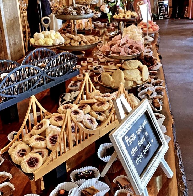 an assortment of pastries on display at a market