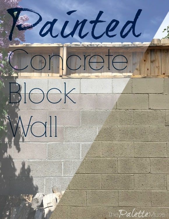 the words painted concrete block wall against a blue sky