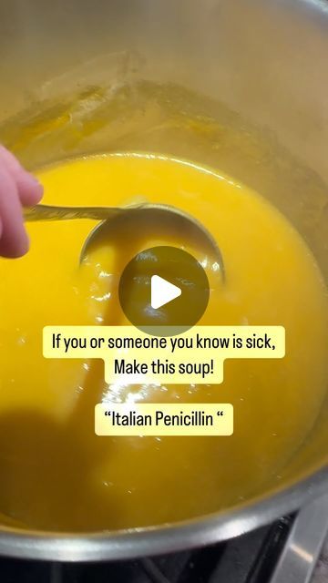 someone is stirring something in a pot with a spoon and some words on the side