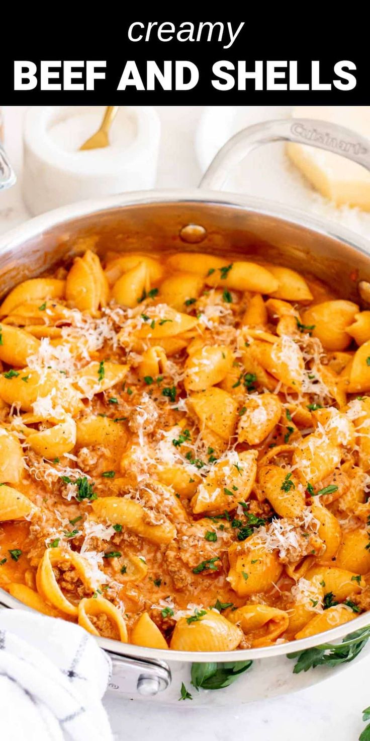 creamy beef and shell pasta in a skillet with parmesan cheese