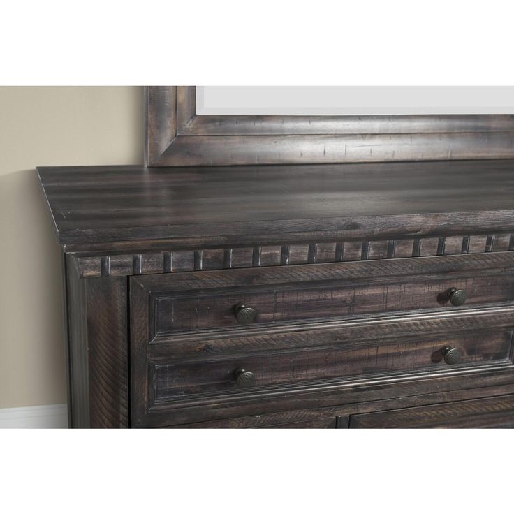 the dresser is made from wood and has two drawers