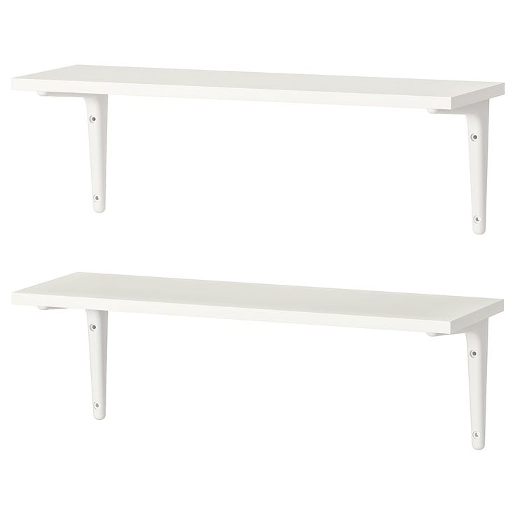 two white shelves sitting next to each other