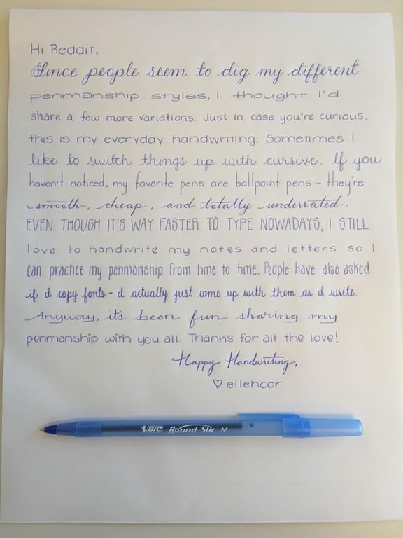 a blue pen sitting on top of a white piece of paper next to a note