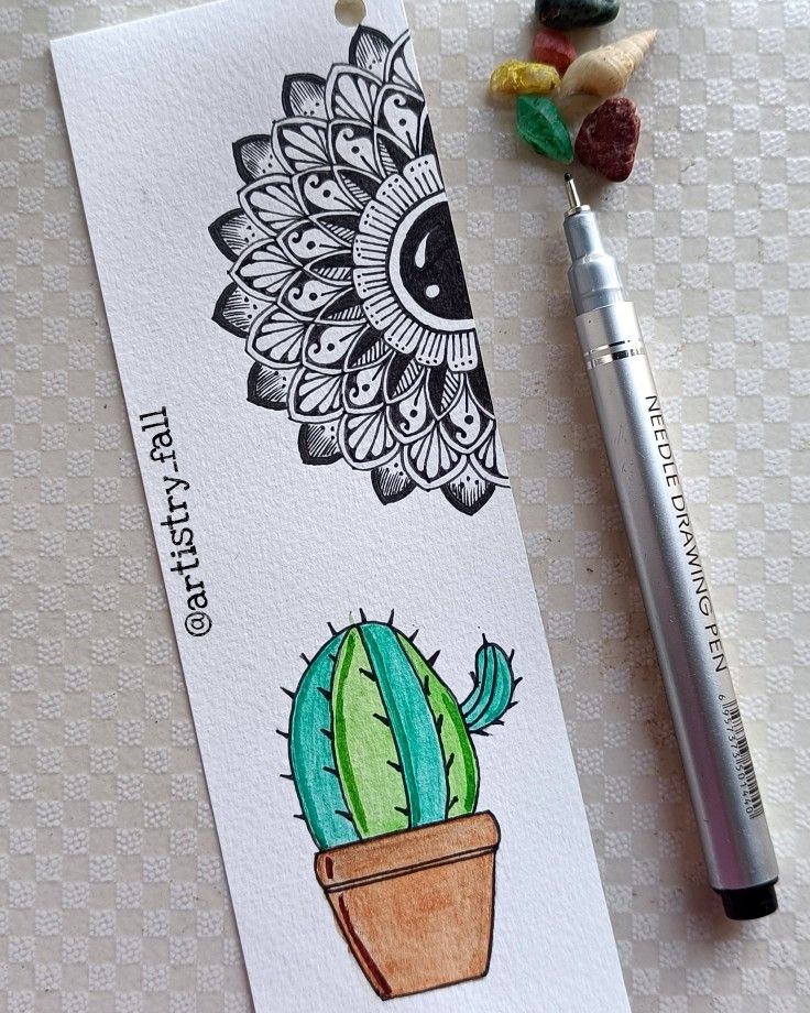 a drawing of a cactus in a flower pot next to a marker and some candy