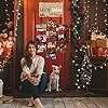 a woman sitting on the floor in front of a store with christmas decorations and presents