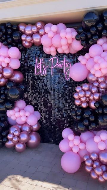 balloons and streamers decorate the entrance to a party