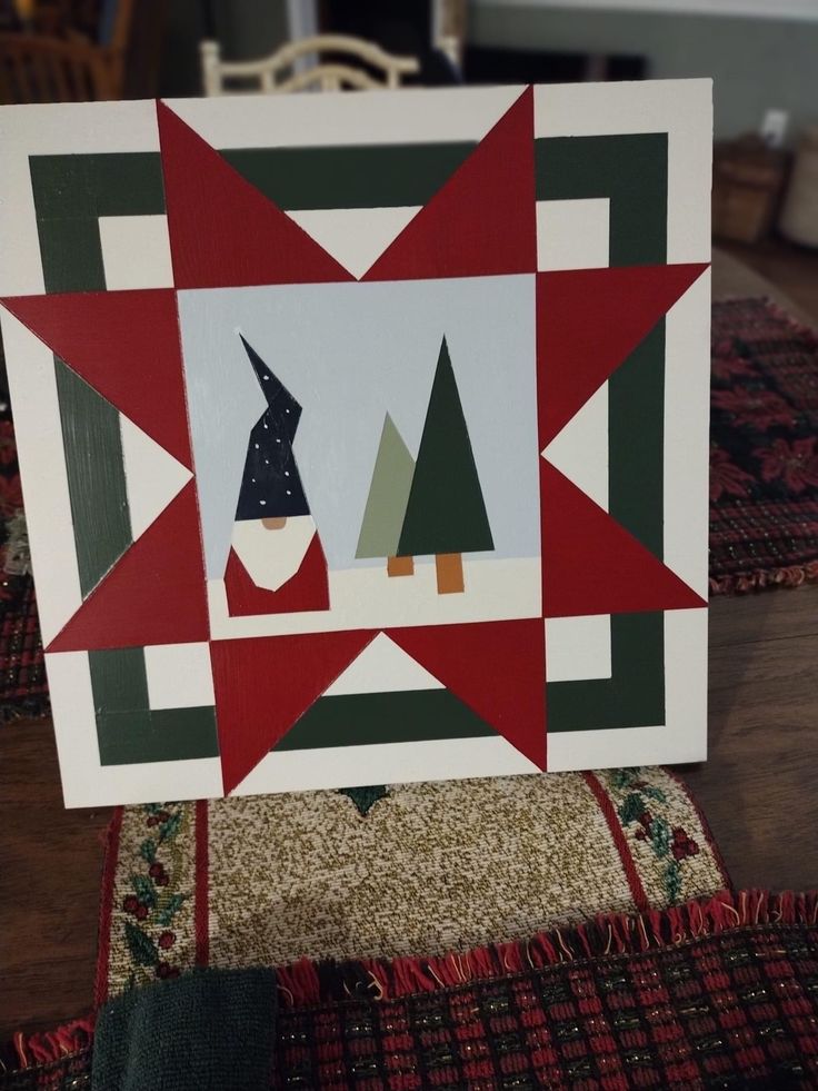 a quilted christmas card with trees on it