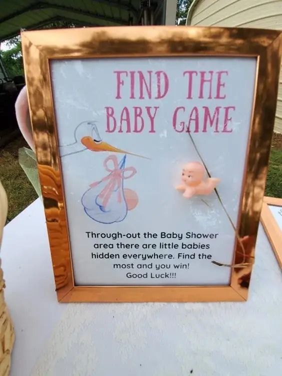 a sign that is on top of a table in the shape of a baby game