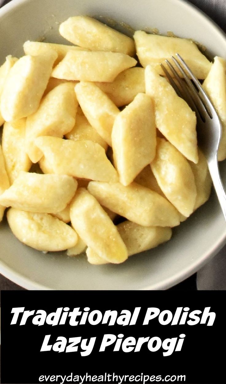 a white bowl filled with sliced up bananas next to a knife and fork on top of a table