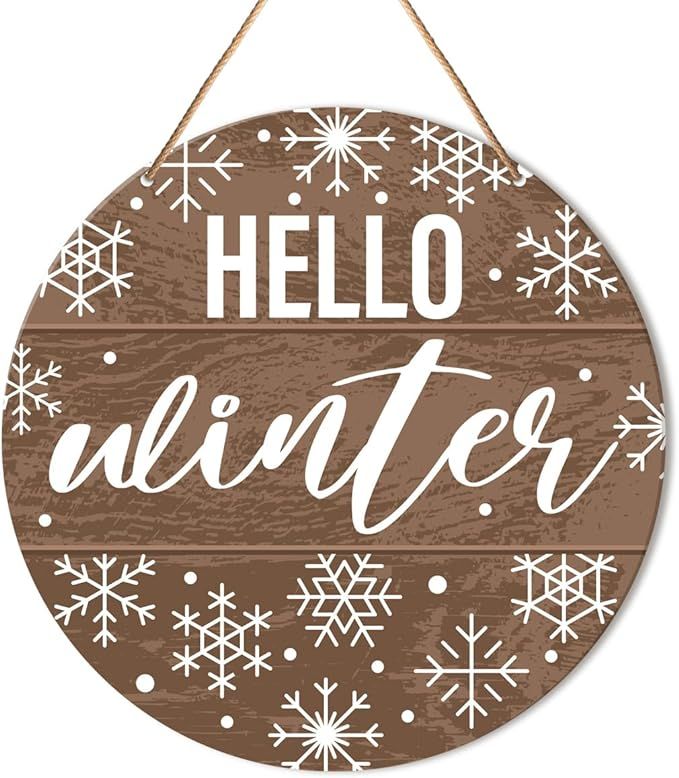 a wooden sign that says hello winter with snowflakes hanging from the side of it