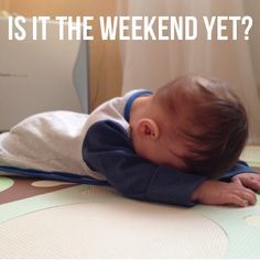 a baby laying on top of a mat with the words is it the weekend yet?