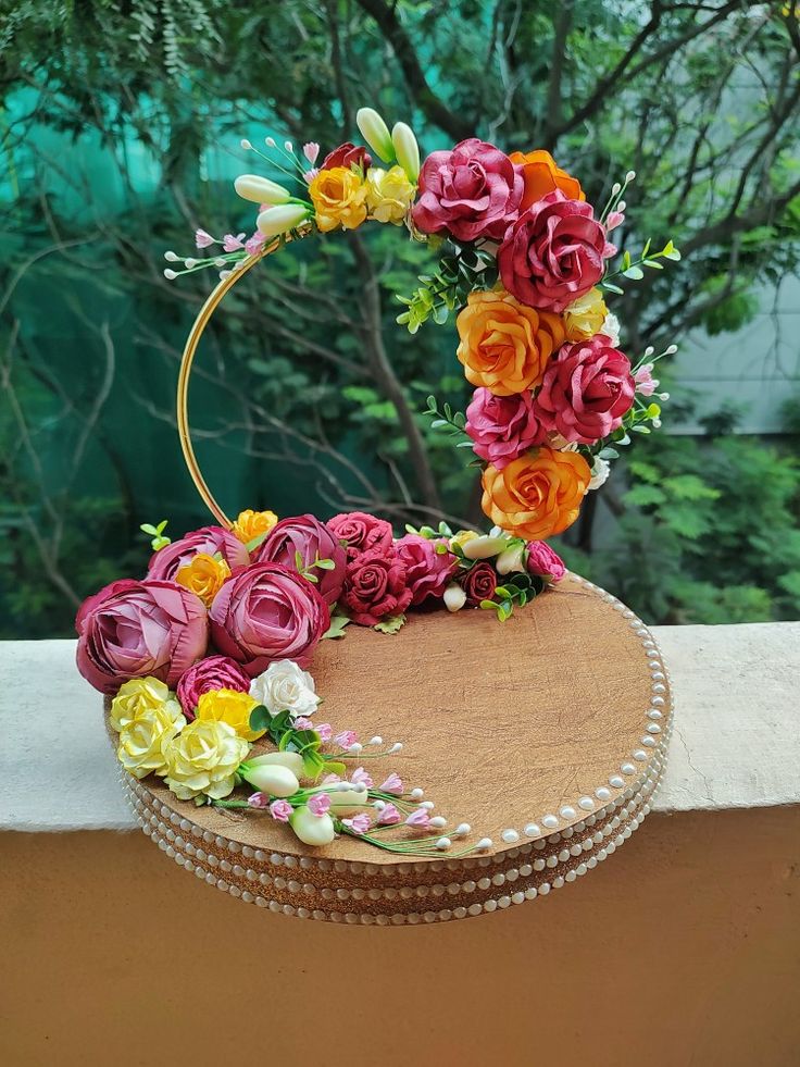 a cake decorated with flowers on top of a table