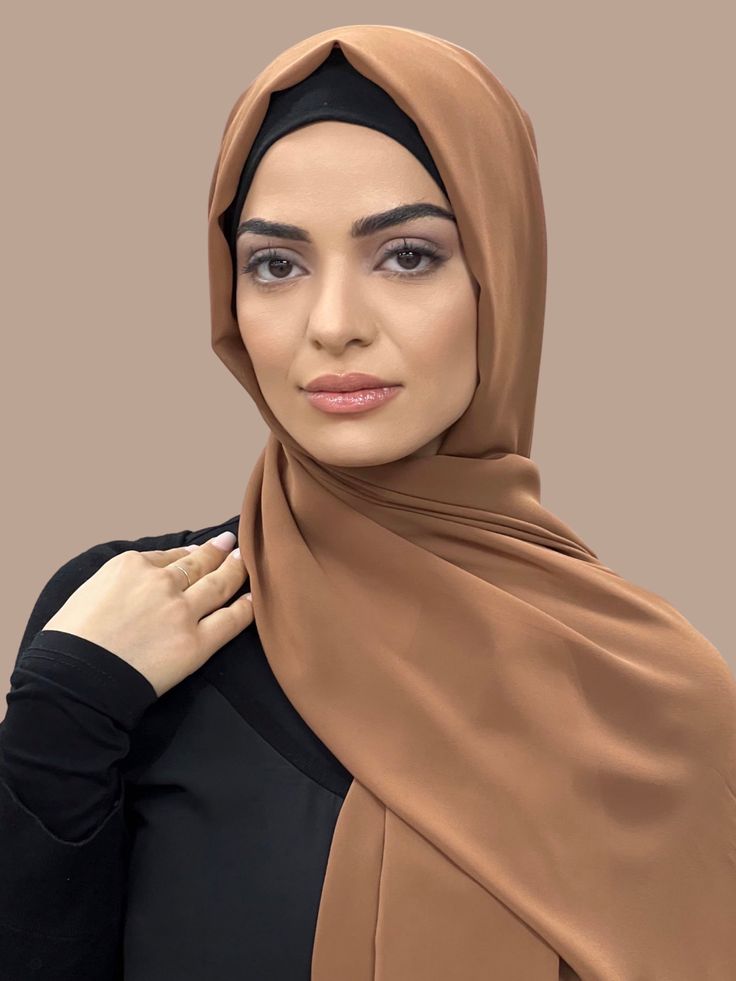 Our Luxury Chiffon hijab-Tawny is perfect for every occasion. With the softest chiffon fabric we could find, our Luxury Chiffon will become your go to hijab whether you're going out to a fancy party or keeping it casual, looking beautiful is effortless! Fabric: Polyester Chiffon Dimension: 70" x 27" Contour: Long Rectangle Thickness: Light Texture: Smooth Care: Machine or hand wash in warm water, tumble dry or air dry, iron if needed Hijab Fabric, Chiffon Hijab, Fancy Party, Light Texture, Chiffon Fabric, Air Dry, Warm Water, Going Out, Chiffon