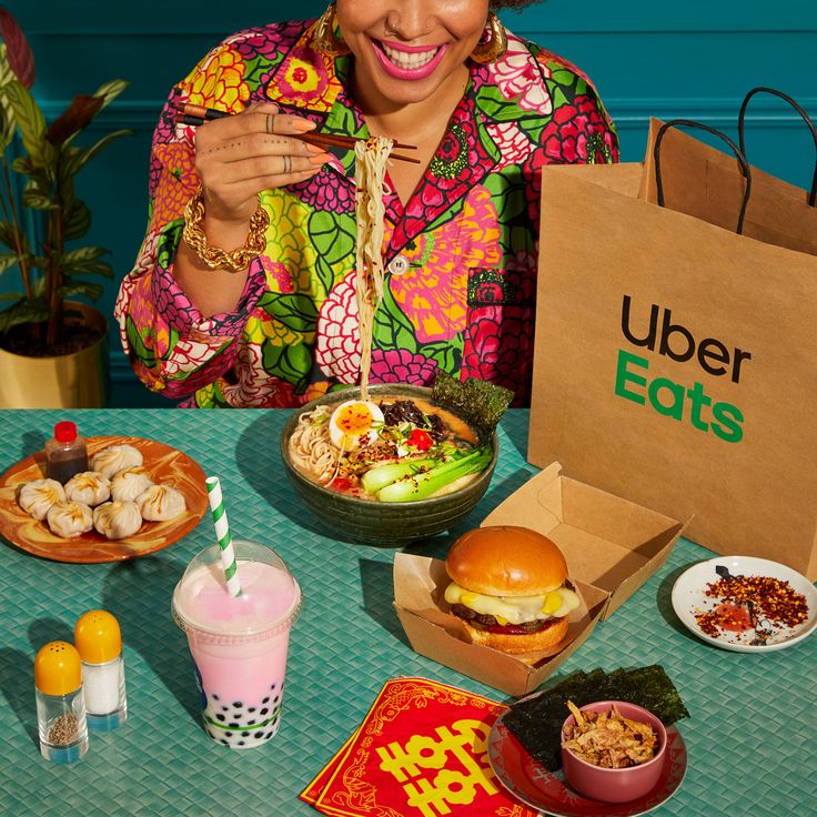 a woman sitting at a table full of food