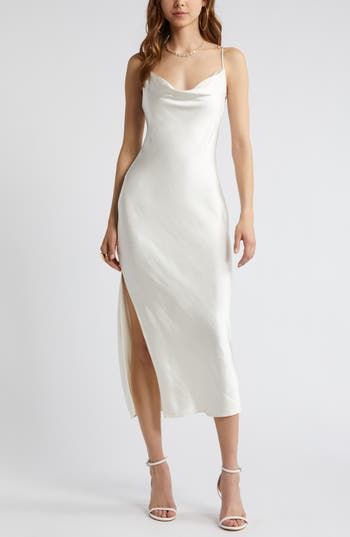 Effortless to style up or down, this gracefully draped satin slipdress belongs in your wear-on-repeat collection. 26 1/2" to 46" center front length (size Medium) Cowl neck Adjustable straps Unlined 100% polyester Machine wash, tumble dry Imported Cowl Neck Reception Dress, White Cowl Neck Dress, White Satin Slip Dress, White Silk Slip Dress, Silk White Dress, Cowl Neck Wedding Dress, Graduation Dress White, Ivory Silk Dress, Flowy White Dress