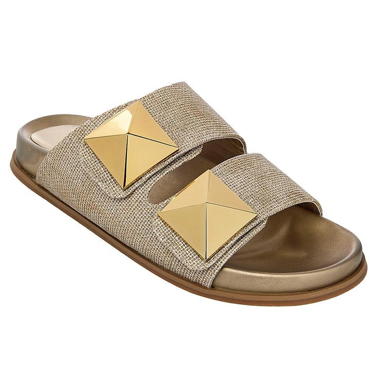 SHUSHOP BERNARDA Pyramid Slide Sandal The wide straps and molded footbeds of these slide sandals turn them into one of our most comfortable and sophisticated options for warm weather dressing. The oversized metallic studs can dress up any outfit.  Good to Know       Fit runs small, so we recommend going up a half-size. Beige Slides With Textured Footbed, Summer Slides With Cork-bed Midsoles, Summer Slippers With Cork-bed Midsoles, Chic Gold Slides For Vacation, Beach Slide Footbed Sandals With Branded Insole, Comfortable Gold Open Toe Sandals, Comfortable Mules With Buckle Closure For Summer, Chic Gold Slides For Beach, Vacation Slides With Textured Sole And Open Toe