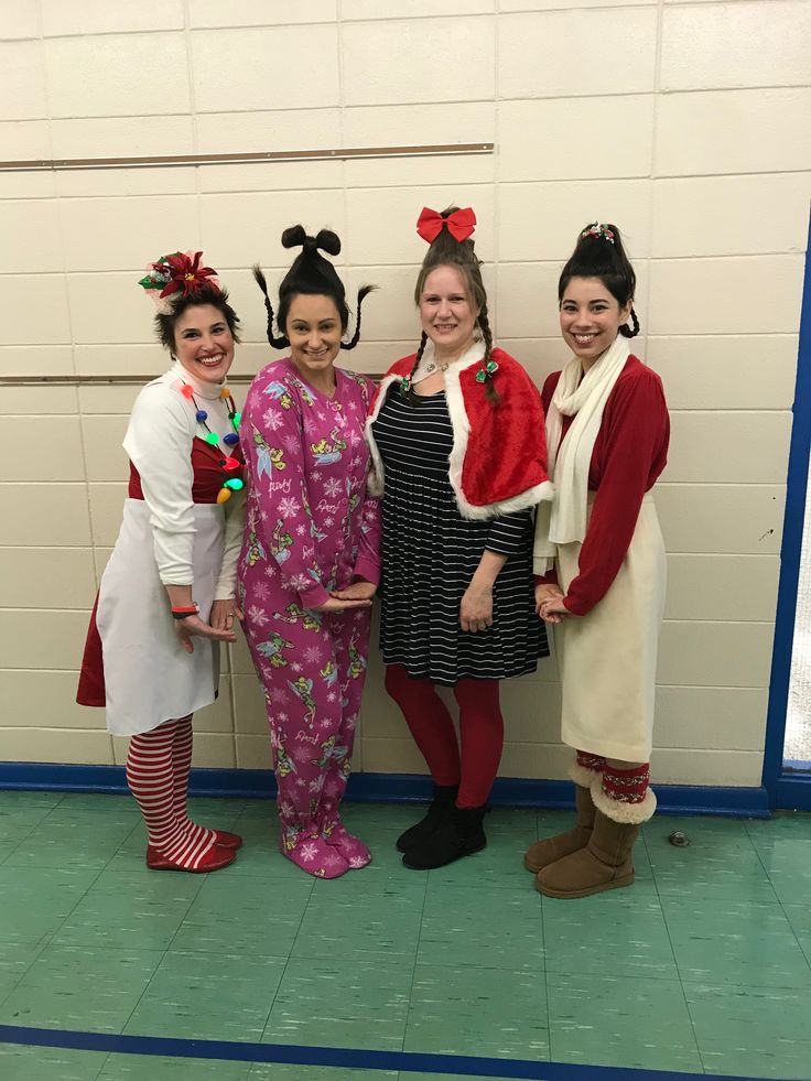 three women in costumes standing next to each other