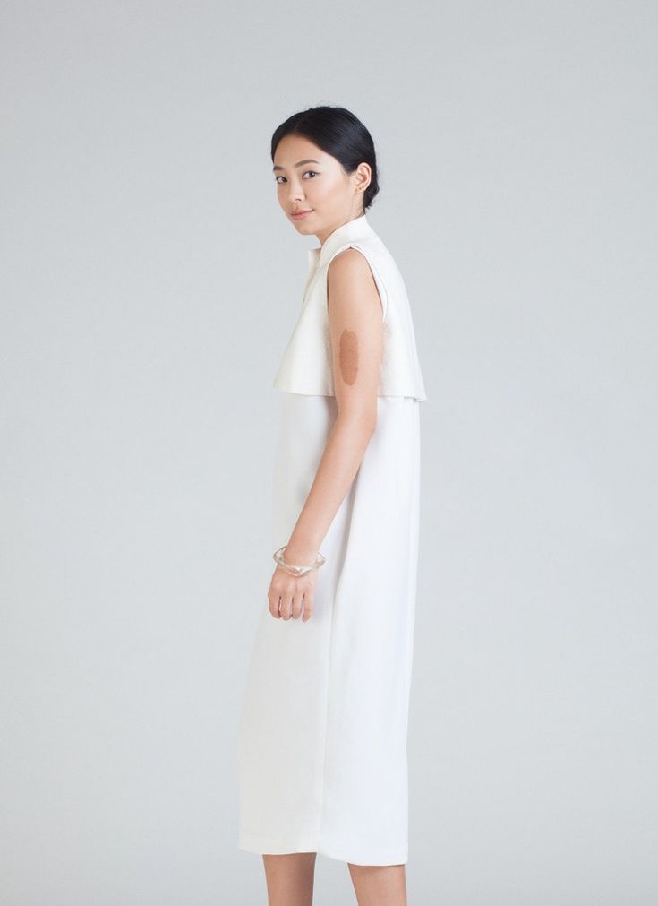 KAAREM - Dill High Collar Dress - White Chic High Neck Dress For Daywear, White Midi Dress With Pleated Back, Chic High Neck Daywear Dresses, Chic High Neck Day Dresses, Elegant Daywear Dresses With Side Slits, Chic White Midi Dress With Pleated Back, Chic High Neck Midi Dress For Daywear, Elegant Sleeveless Midi Dress With Side Slits, Midi-length Sleeveless Dress With Pleated Back For Work