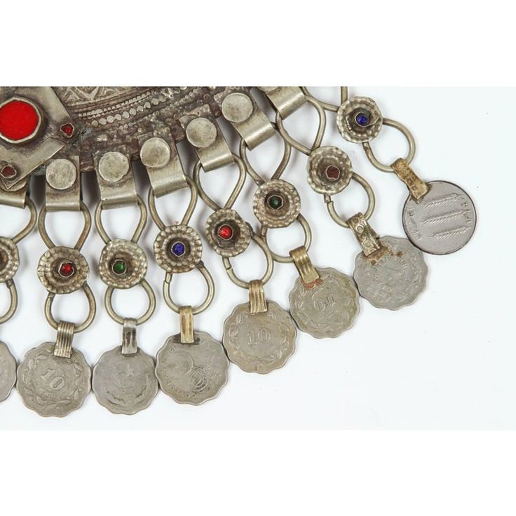 A Moroccan Tribal jewelry vintage a chocker inlaid with colorful glass beads in red and green and dangling coins. Silver, but not of the standard of sterling and richly embellished with applied silver designs and filigree.  Chocker size: 10" height x 10" wide including coins. chocker only is 8" x 8". German nickel coin silver. A Moroccan beautiful ethnic metal silvered jewelry choker.It is a traditional piece of jewelry that is worn around the neck handmade by skilled artisans in Morocco and ref Traditional Filigree Jewelry, Ornate Red Jewelry For Ceremonial Occasions, Red Vintage Jewelry For Festivals, Traditional Medallion Coin Necklace, Ornate Red Jewelry For Festivals, Traditional Medallion Jewelry From Vintage Collection, Vintage Red Jewelry For Festivals, Traditional Red Jewelry For Collectible, Traditional Red Jewelry For Collectors