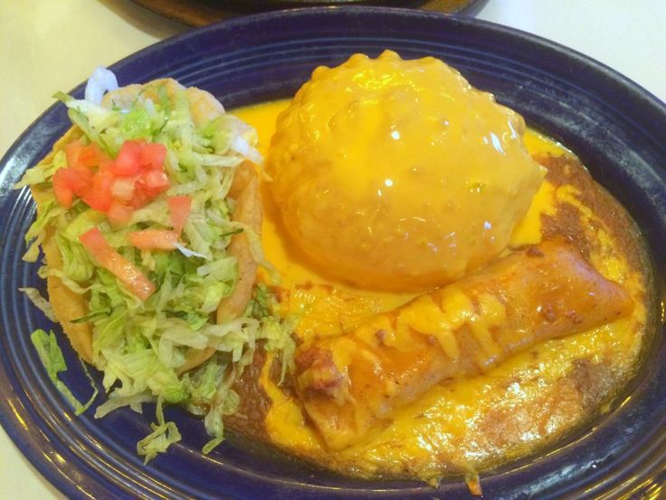 a blue plate topped with different types of food