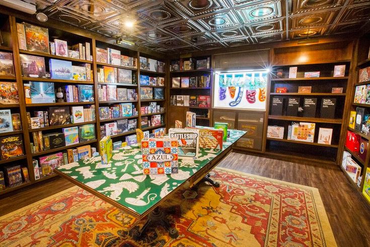 a room filled with lots of books and games