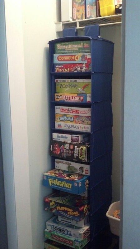 there is a blue tower that has many games on top of it in the corner