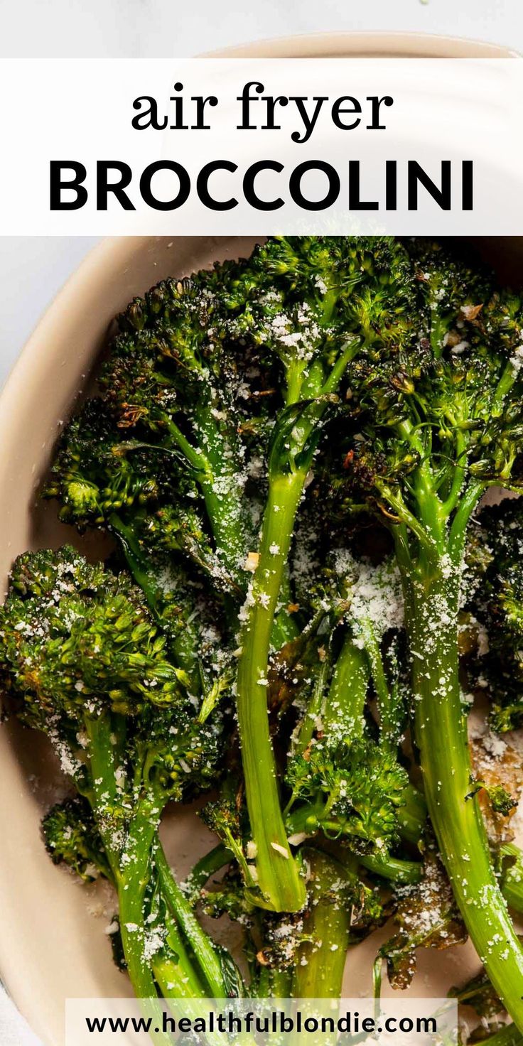 broccoli florets with parmesan cheese on top in a white bowl