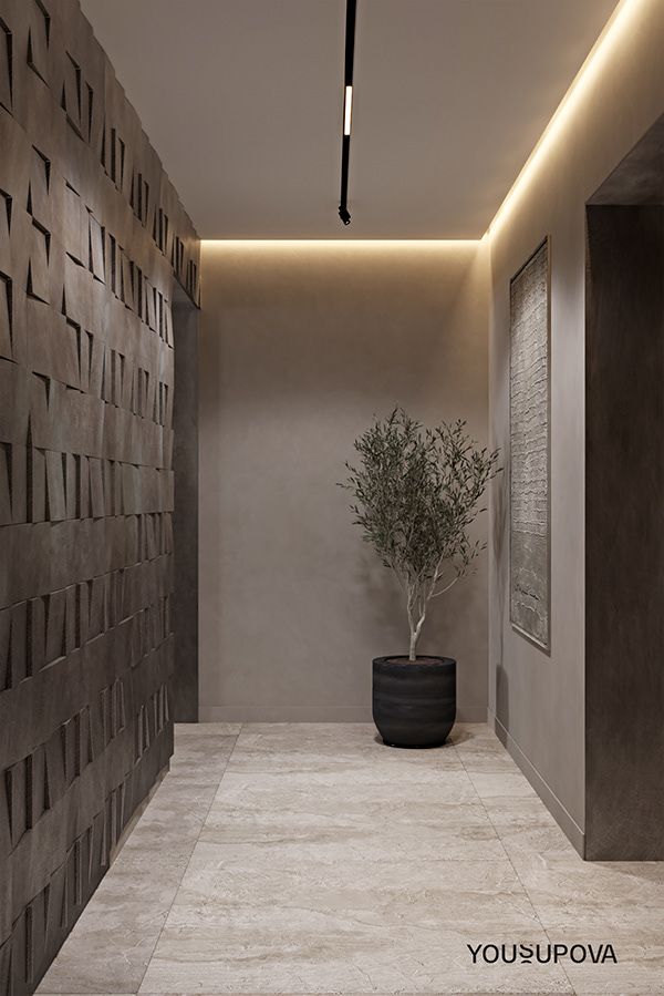 a potted plant sitting in the middle of a room next to a wall with lights on it