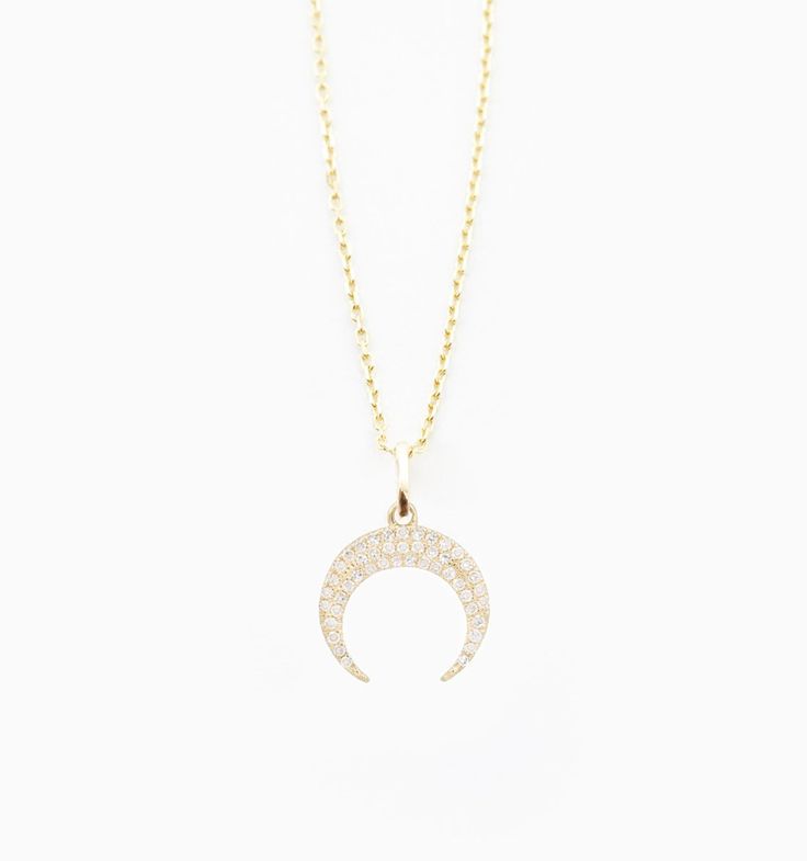 Made for forever, the 24/7 solid gold necklace you'll never take off. This necklace is tarnish free and will not irritate your skin, so you can wear this piece all day everyday without a worry. 
A classic moon pendant with diamond studs to make it shimmer. In 14k gold with diamond accents this piece is made to wear everyday. Dainty Diamond Jewelry With Moon Charm, 14k Gold Celestial Necklace With Single Cut Diamonds, Moon Shaped Sterling Silver Jewelry With Diamond Accents, Celestial Sterling Silver Necklace With Single Cut Diamonds, Moon-shaped Gold Diamond Jewelry, Gold Moon-shaped Diamond Jewelry, Moon Shaped Necklace With Diamond Accents For Gifts, Moon-shaped Necklace With Diamond Accents For Gift, Moon Shaped Diamond Accent Necklace For Gift