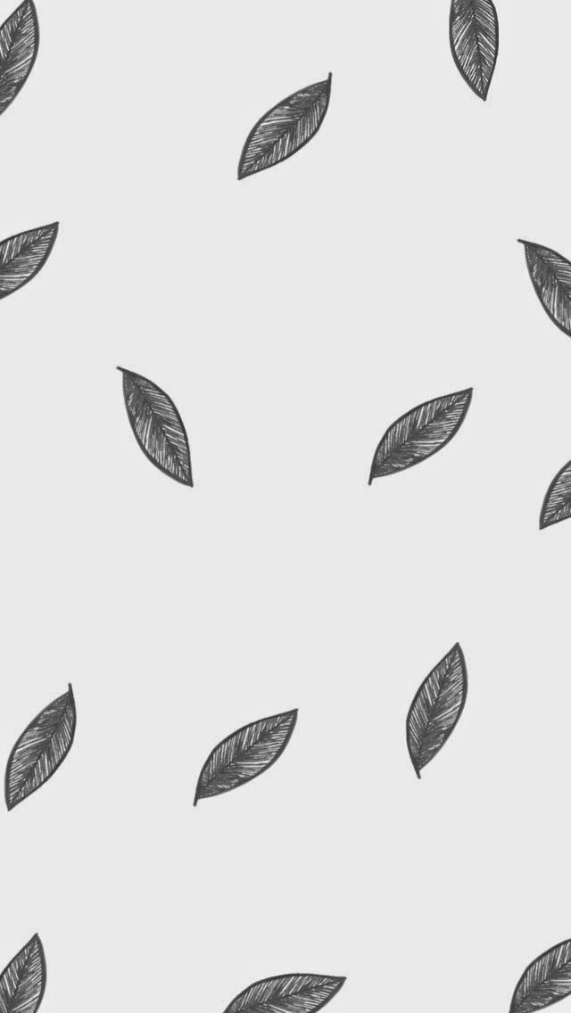 black and white leaves on a light gray background seamless wallpaper pattern with leaf shapes