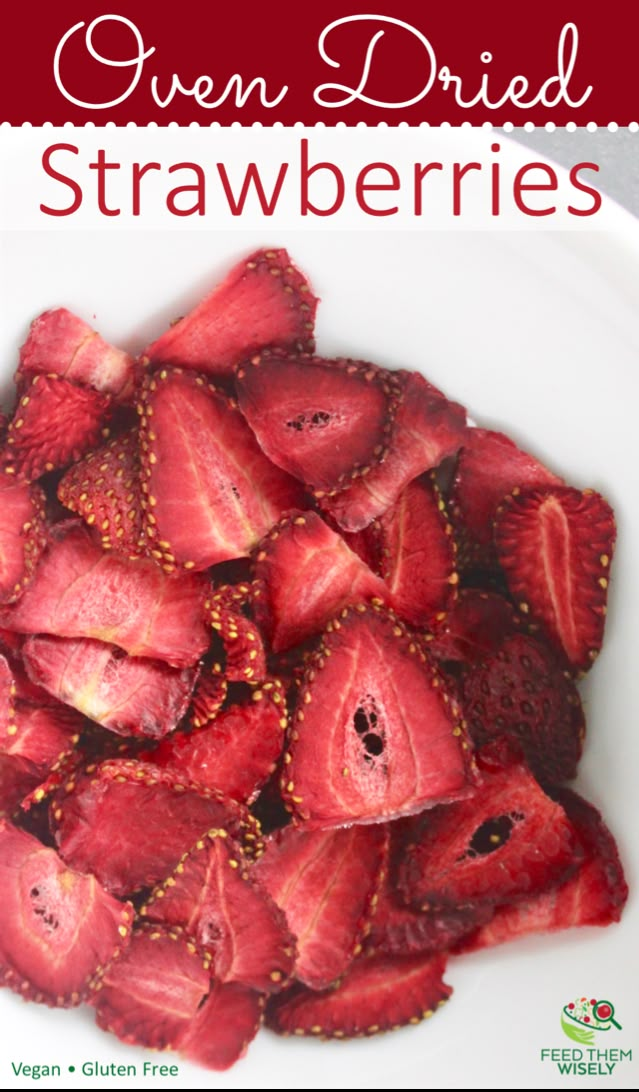 a white plate topped with strawberries on top of a table