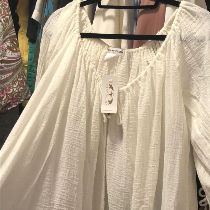 Shay Todd Bnwt Swimsuit Coverup/Top/Tunic White/Cream 100% Cotton (Gauze Like) Very Light, Airy Perfect For A Coverup For A Swimsuit Or Everyday Wear. Switch At Arms And In Front. Size Small But Fits Oversized Flowy White Top For Beach Cover-up, Breezy White Blouse For Spring, White Breezy Blouse For Spring, Chic Summer Peasant Top For Brunch, Chic Flowy Peasant Top For Summer, Chic Cotton Peasant Top For Summer, White Feminine Peasant Top For Summer, Flowy Summer Peasant Top For Brunch, Cream Top For Spring Beach Cover-up