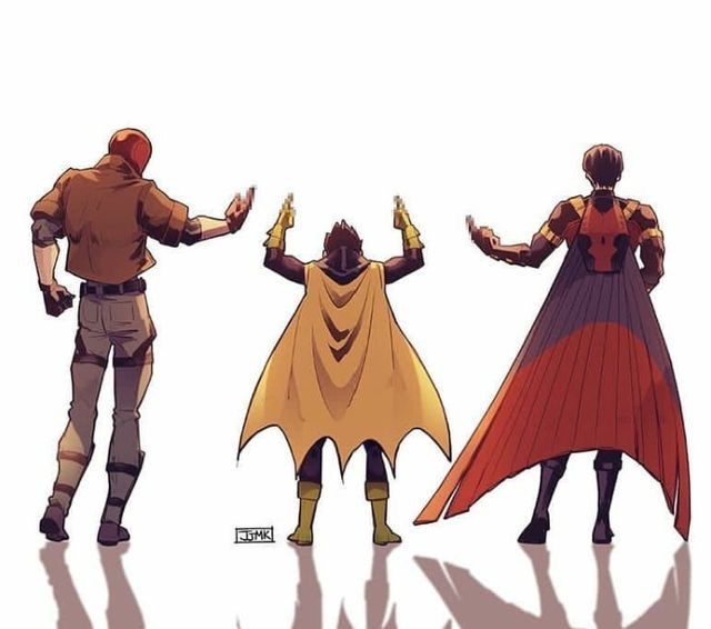 three people standing next to each other with their hands in the air and one person wearing a cape