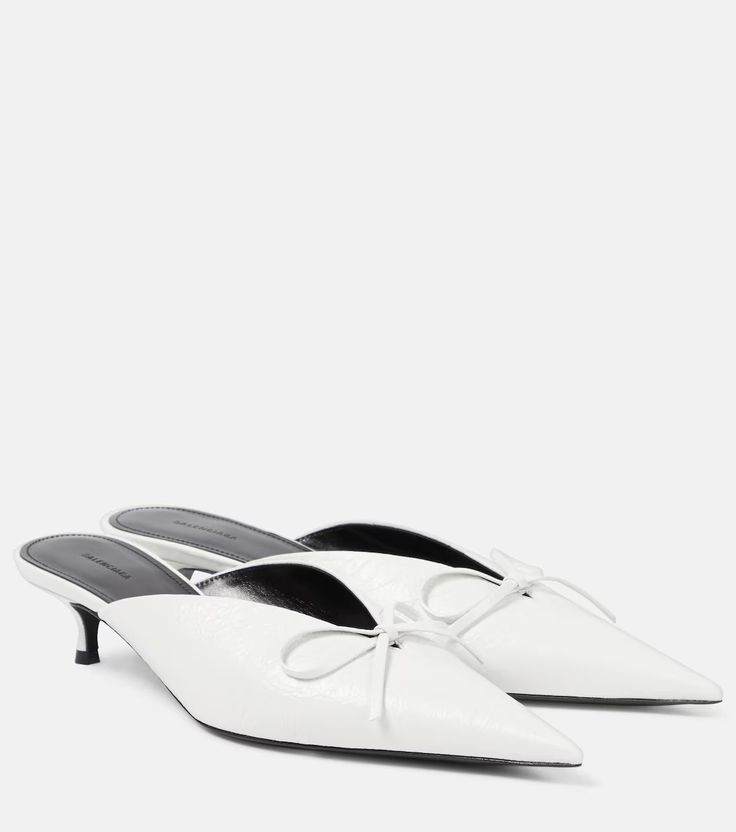 Knife Bow leather mules in white - Balenciaga | Mytheresa Luxury Pointed Toe Mules With Padded Heel, Calf Leather Pointed Toe Mules For Evening, Evening Calf Leather Pointed Toe Mules, Evening Pointed Toe Calf Leather Mules, Party Calf Leather Pointed Toe Mules, Business Mules With Sculpted Heel And Pointed Toe, Pointed Toe Calf Leather Party Mules, Pointed Toe Calf Leather Mules For Party, Modern Pointed Toe Mules For Formal Occasions