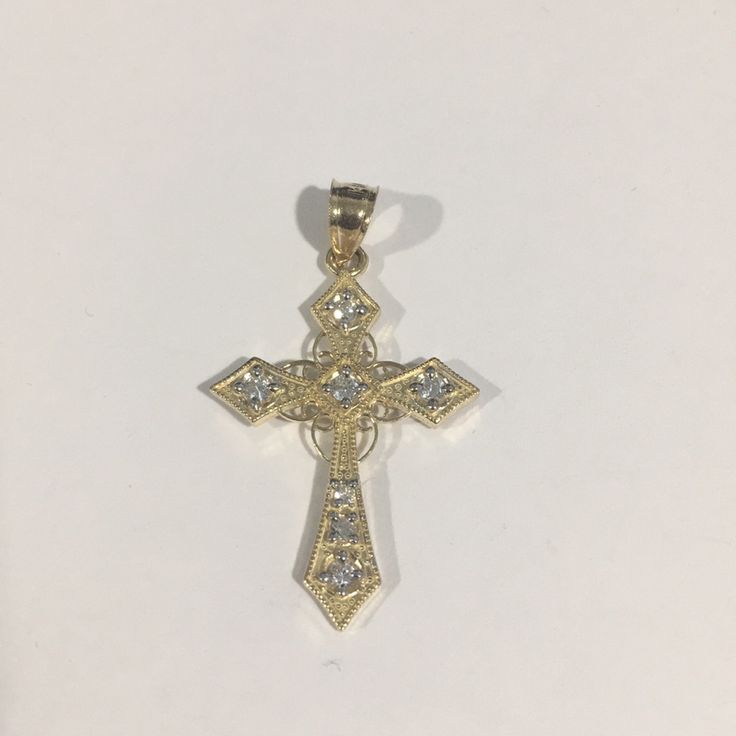 Beautiful 14k Yellow Gold Cross Pendant With Cz Stones . Weight: 1.8g. Length: 1.30" With Bail. Width: 0.75". New Without Tags!!! Yellow Gold Cubic Zirconia Cross Pendant, Yellow Gold Cubic Zirconia Cross Jewelry, Yellow Gold Cross Pendant With Diamond Accents, Yellow Gold Cross Pendant Jewelry With Diamond Accents, 14k Gold Cross Jewelry With Diamond Accents, Yellow Gold Diamond Cross Pendant Jewelry, Yellow Gold Diamond-accented Diamond-shaped Jewelry, 14k Gold Cross Jewelry With Brilliant Cut, Hallmarked 14k Gold Jewelry In Diamond White