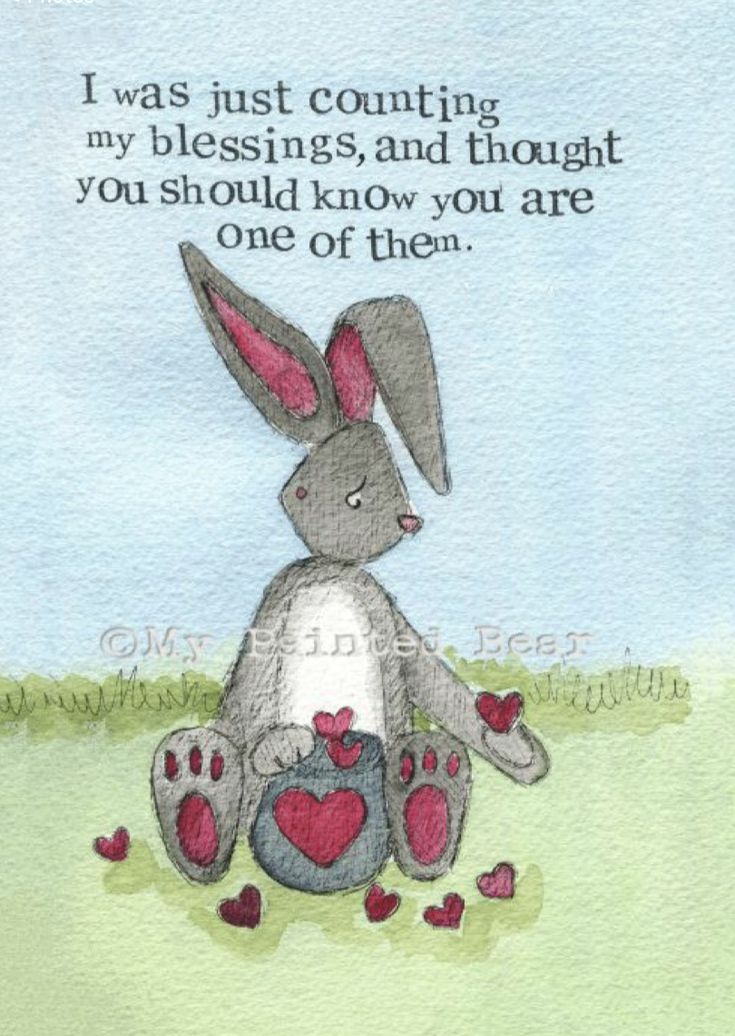 a drawing of a bunny sitting in the grass with hearts on it's feet