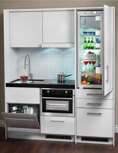 an open refrigerator in the middle of a kitchen