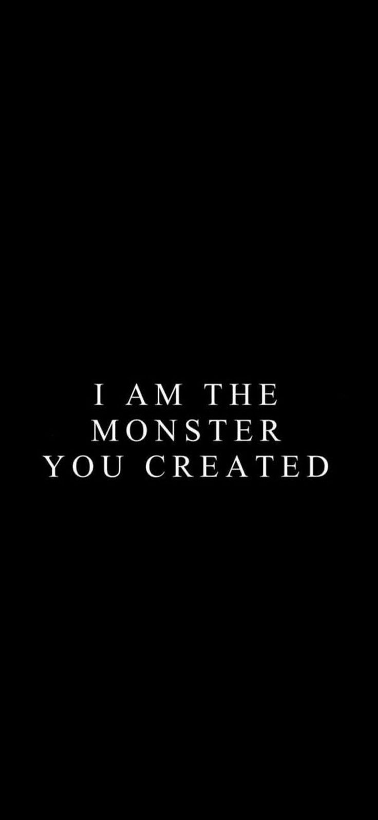 i am the monster you created text in black and white on a dark background with an arrow