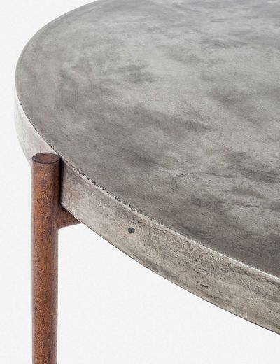 a close up of a metal table with a wooden leg and round top, on a white background