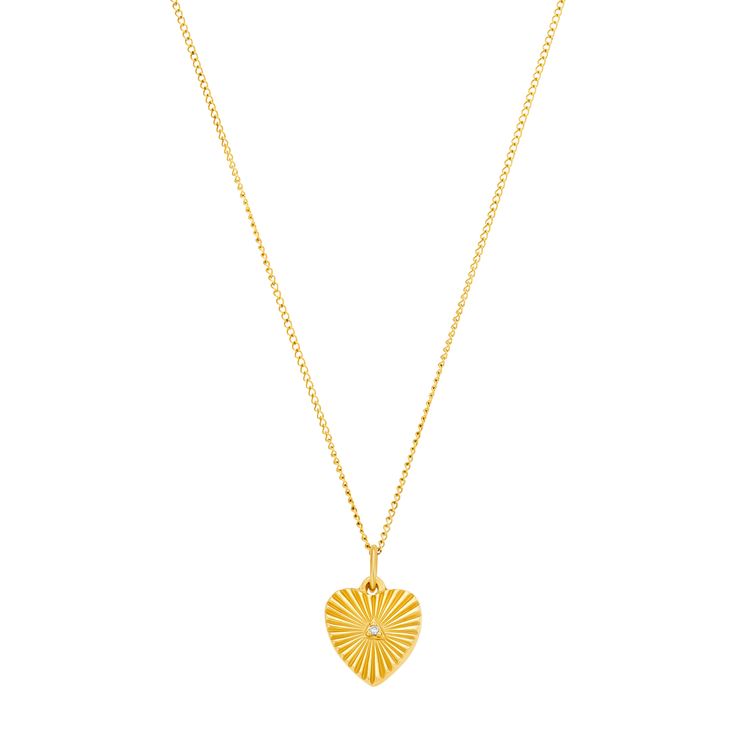 The 18K Yellow Gold Heart Medallion Necklace showcases a large flat heart with a .06ct diamond - a luxurious symbol of love and a dazzling addition to any ensemble. Details Gold Chain Large ILLUME Heart Medallion .06ct Diamond Metal Care Use the white side of the provided ILLUME Jewelry polishing cloth to gently wipe clean, then remove any remaining tarnish with mild diluted soap. Rinse with warm water and dry thoroughly before storing the piece in its jewelry pouch. Gemstone Care Use a soft cloth to gently wipe clean, then remove any remaining impurities with mild diluted soap. Rinse with warm water and dry thoroughly before storing in the provided jewelry pouch. Gold Heart-shaped Diamond Necklace With Single Diamond, Luxury Diamond Heart Charm Necklace, Luxury Heart Cut Necklace With Heart Charm, Gold Heart Necklace With Single Diamond, Heart-shaped Diamond Engraved Necklace, Engraved Heart Diamond Necklace, Luxury Engraved Heart Cut Necklace, Medallion Necklace, Mini Heart