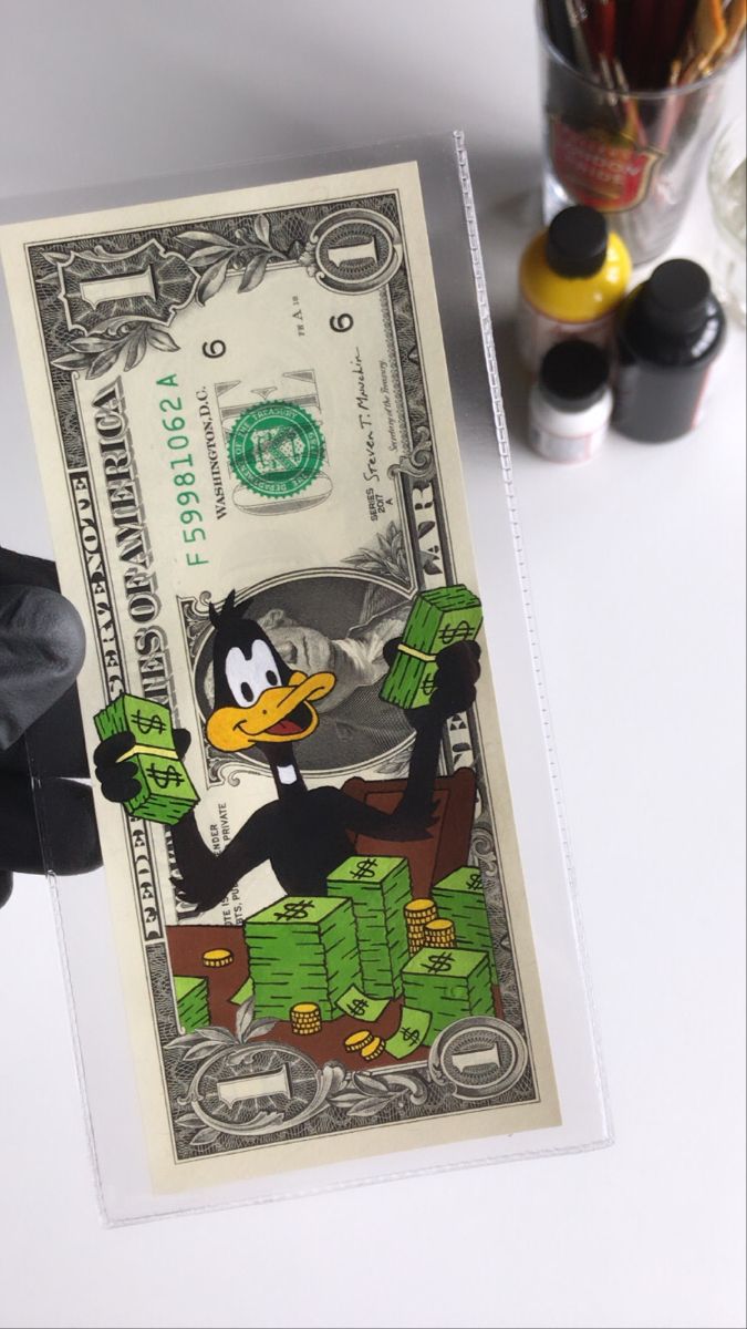 a dollar bill with a cartoon penguin on it