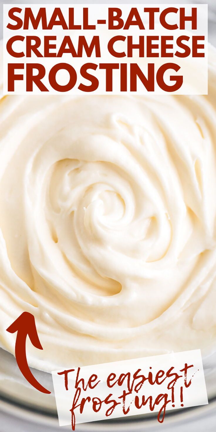 a bowl filled with cream cheese frosting on top of a table