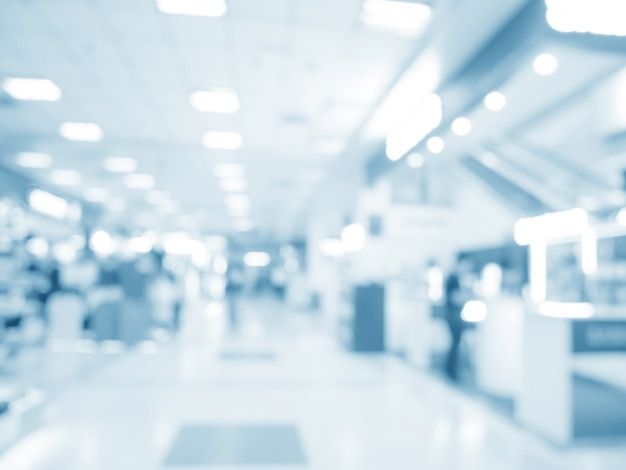 blurry image of people walking in an airport