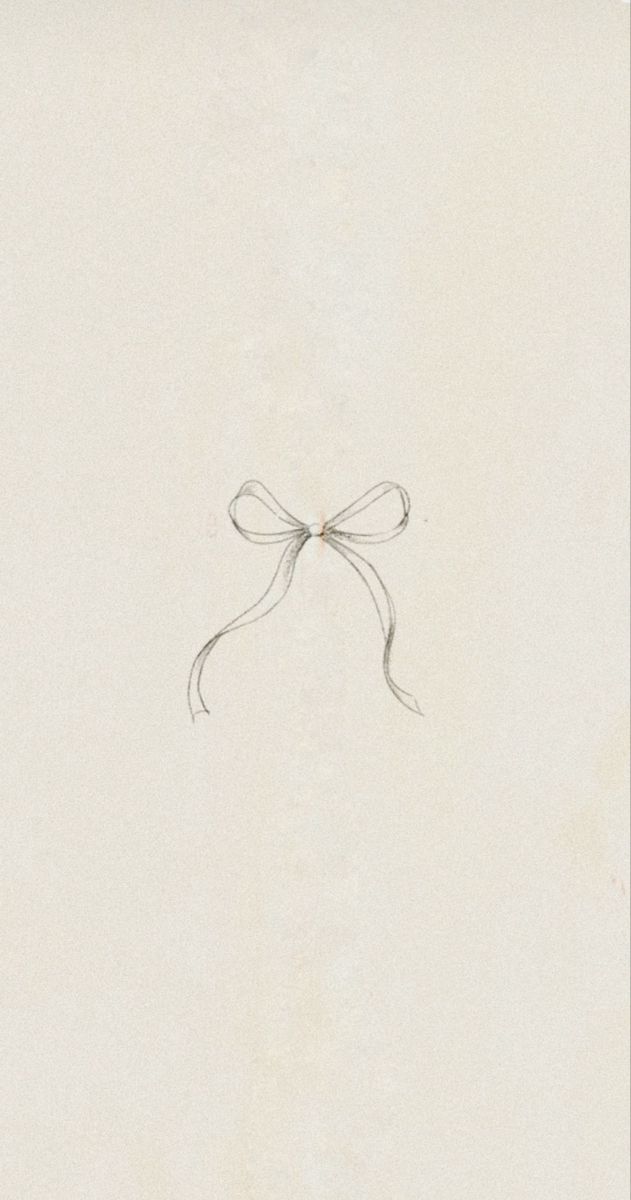 a drawing of a bow on the side of a white wall with writing underneath it