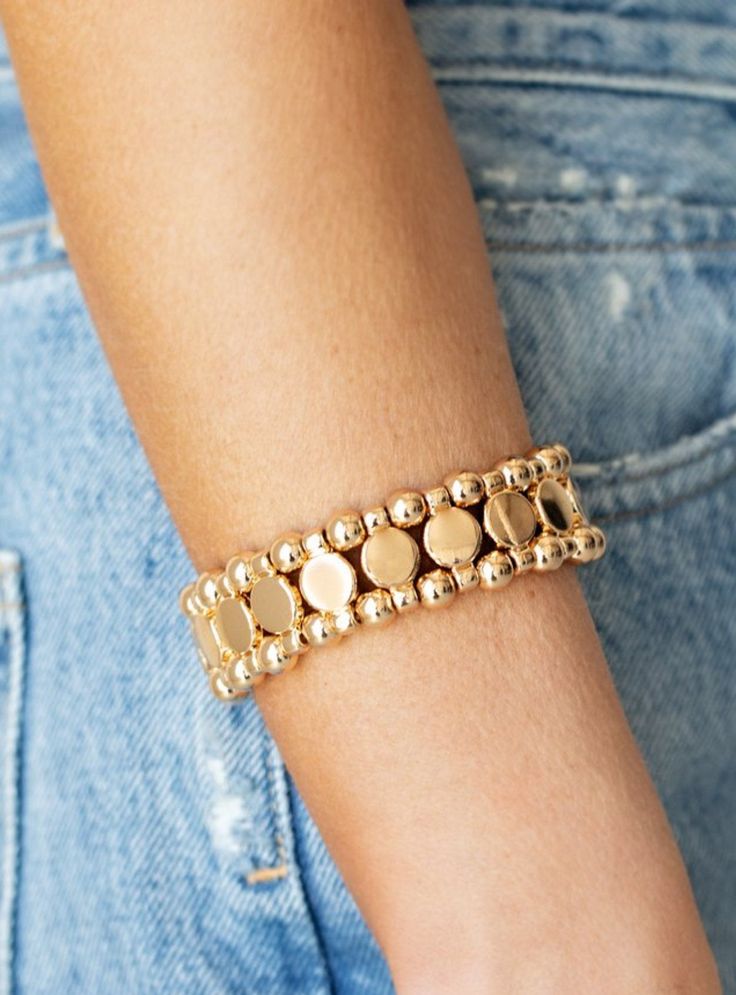 "Metro Magnetism": Glistening gold disc fittings and pairs of classic gold beads are threaded along stretchy bands around the wrist that connect into a bold industrial display around the wrist. Sold as one individual bracelet. Live Text, Trendy Fringe, Industrial Display, Gold Stretch Bracelet, Back Necklace, Gold Disc, Ball Necklace, Paparazzi Accessories, Stretchy Bracelets