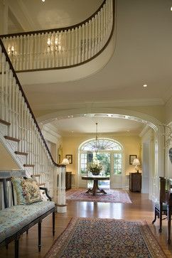 an entry way leading to a living room and dining room