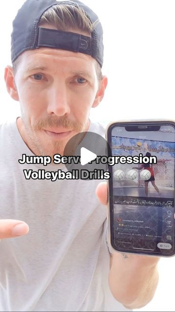 a man holding up a cell phone with the caption jump serve progression volleyball drills