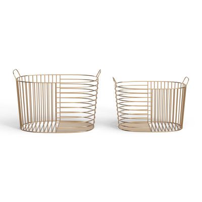 two metal wire baskets sitting next to each other on a white background, one is empty and the other has no handles